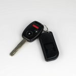 a car key with a remote control attached to it