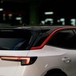 a white car parked in a parking garage