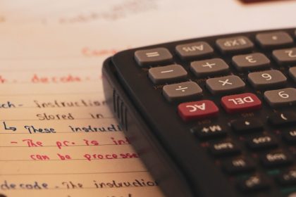 a calculator sitting on top of a piece of paper