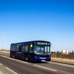 blue and yellow bus on road during daytime