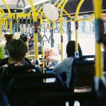 people sitting on chair inside train