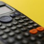 black remote control on yellow surface
