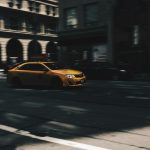 selective focus photo of beige metallic sedan