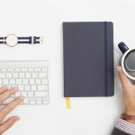 person holding black mug filled with black liquid