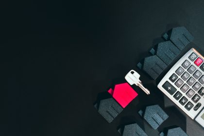 A cell phone sitting on top of a keyboard