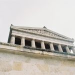 white building with columnds